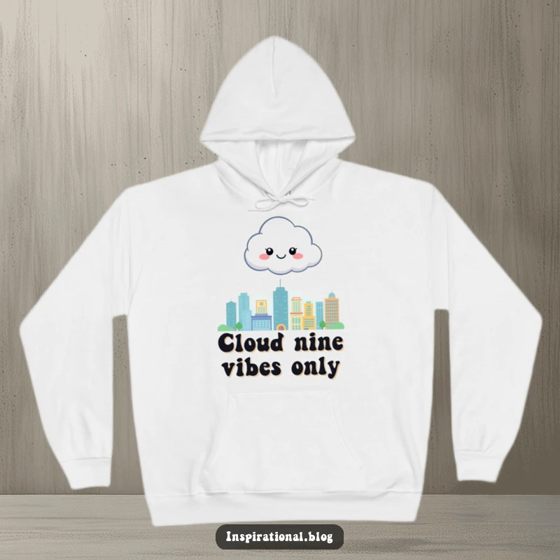 Funny hoodie featuring a smiling cloud character hovering peacefully above a stylized city, offering comfort and a cheerful vibe.