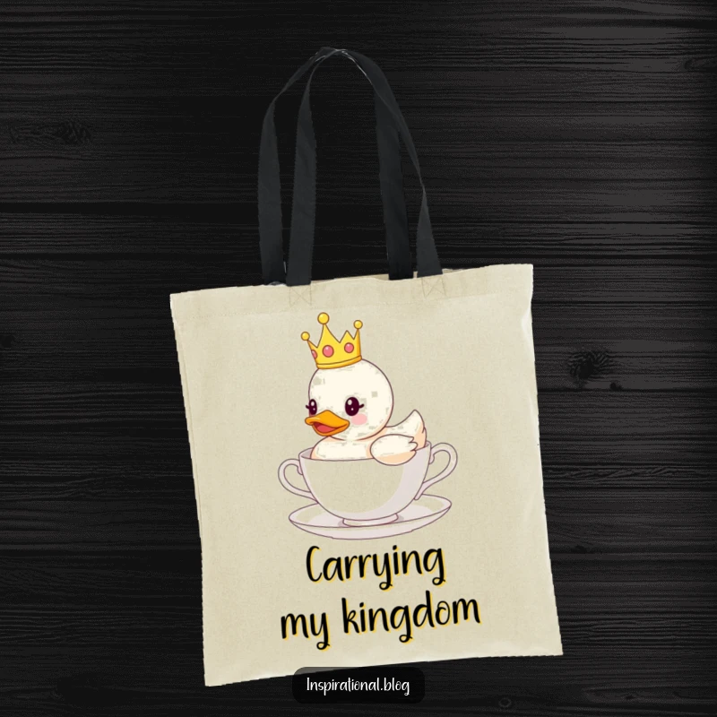 Funny tote bag with a rubber duck wearing a crown, floating on a teacup, perfect for carrying essentials with a touch of humor.